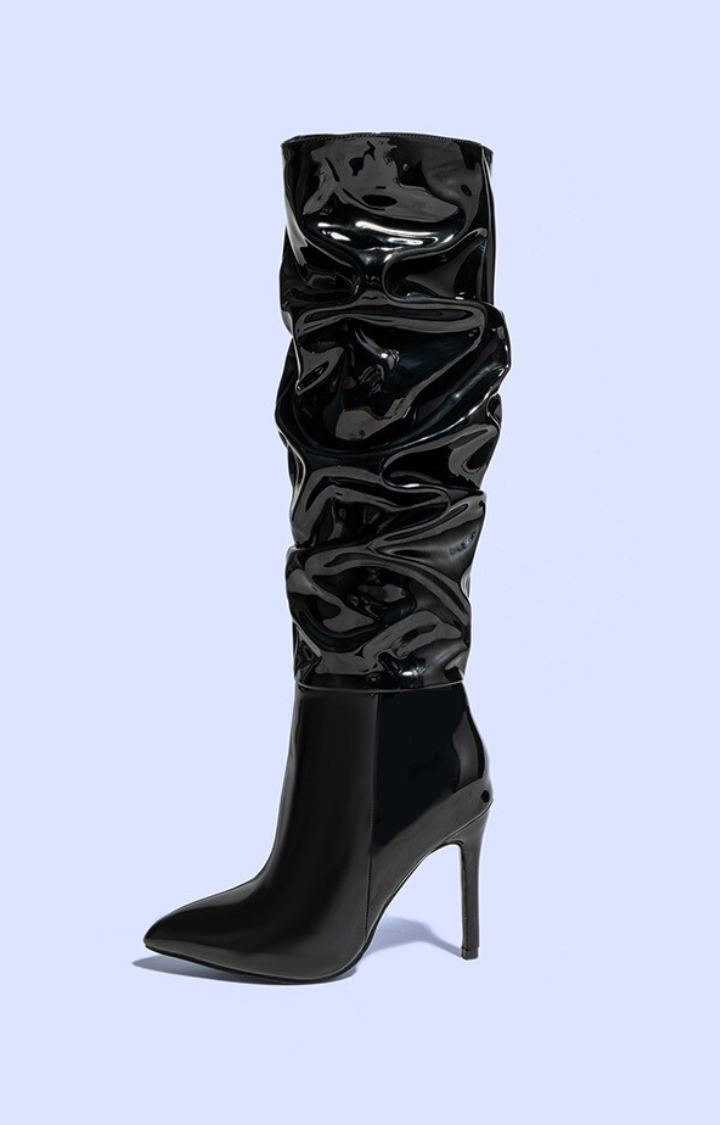 RIOT PATENT RUCHED KNEE-HIGH BOOTS IN BLACK LICORICE